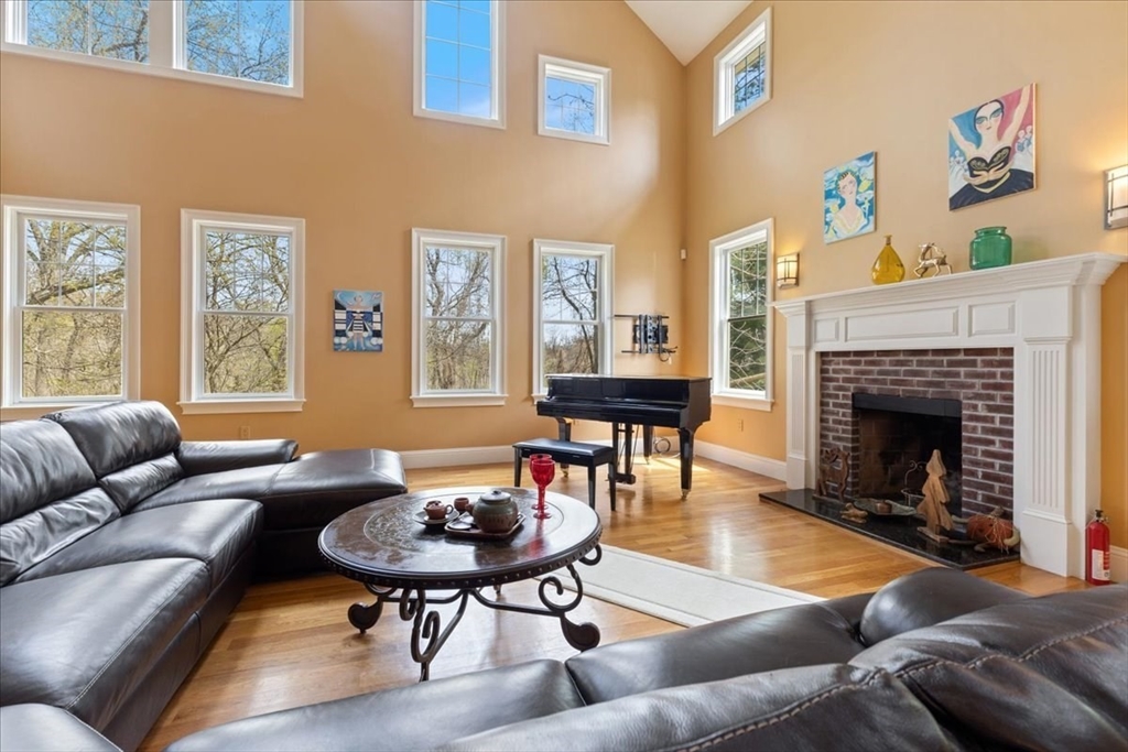8 Middleby Road Lexington, MA 02421 - Photo 9 of 42 a living room with furniture a rug and a fireplace