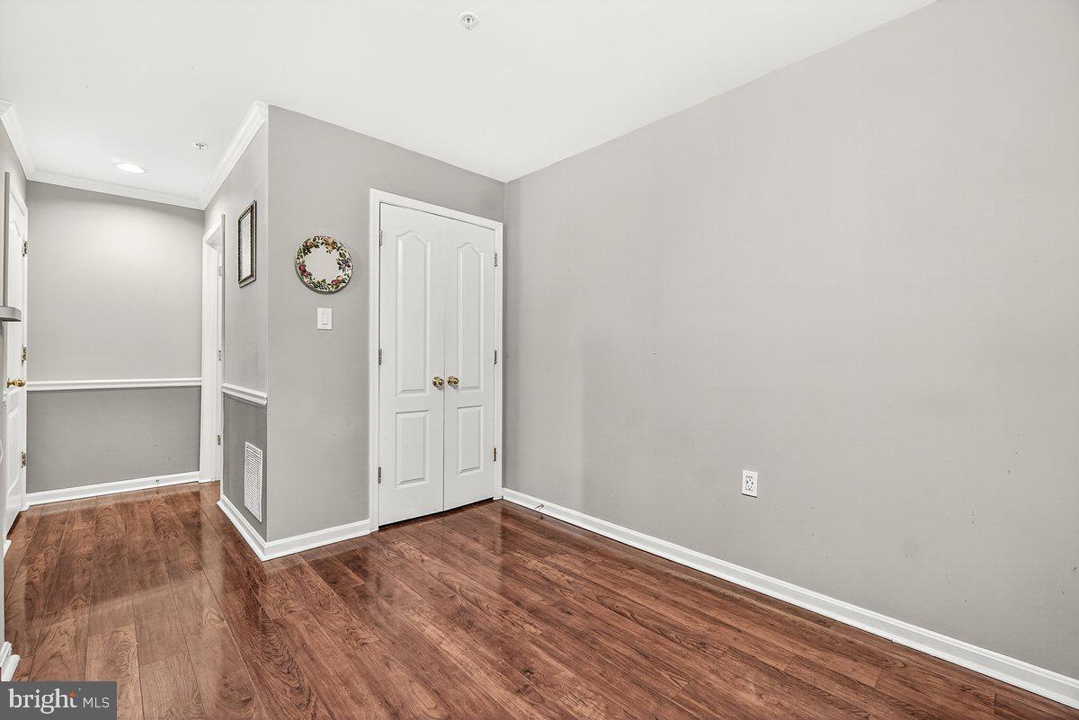 2663 South Everly Drive, Unit 75 Frederick, MD 21701 - Photo 13 of 39 an empty room with wooden floor