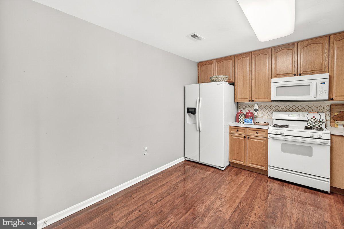 2663 South Everly Drive, Unit 75 Frederick, MD 21701 - Photo 15 of 39 a view of a kitchen with stove and refrigerator