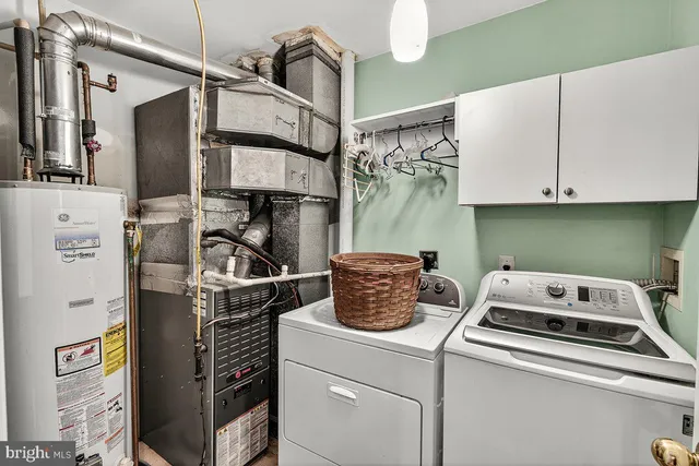 a kitchen with a refrigerator and cabinets