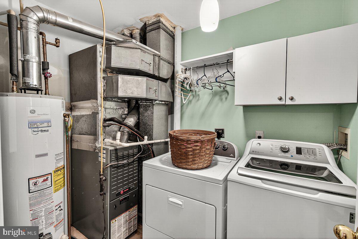 2663 South Everly Drive, Unit 75 Frederick, MD 21701 - Photo 18 of 39 a kitchen with a refrigerator and cabinets