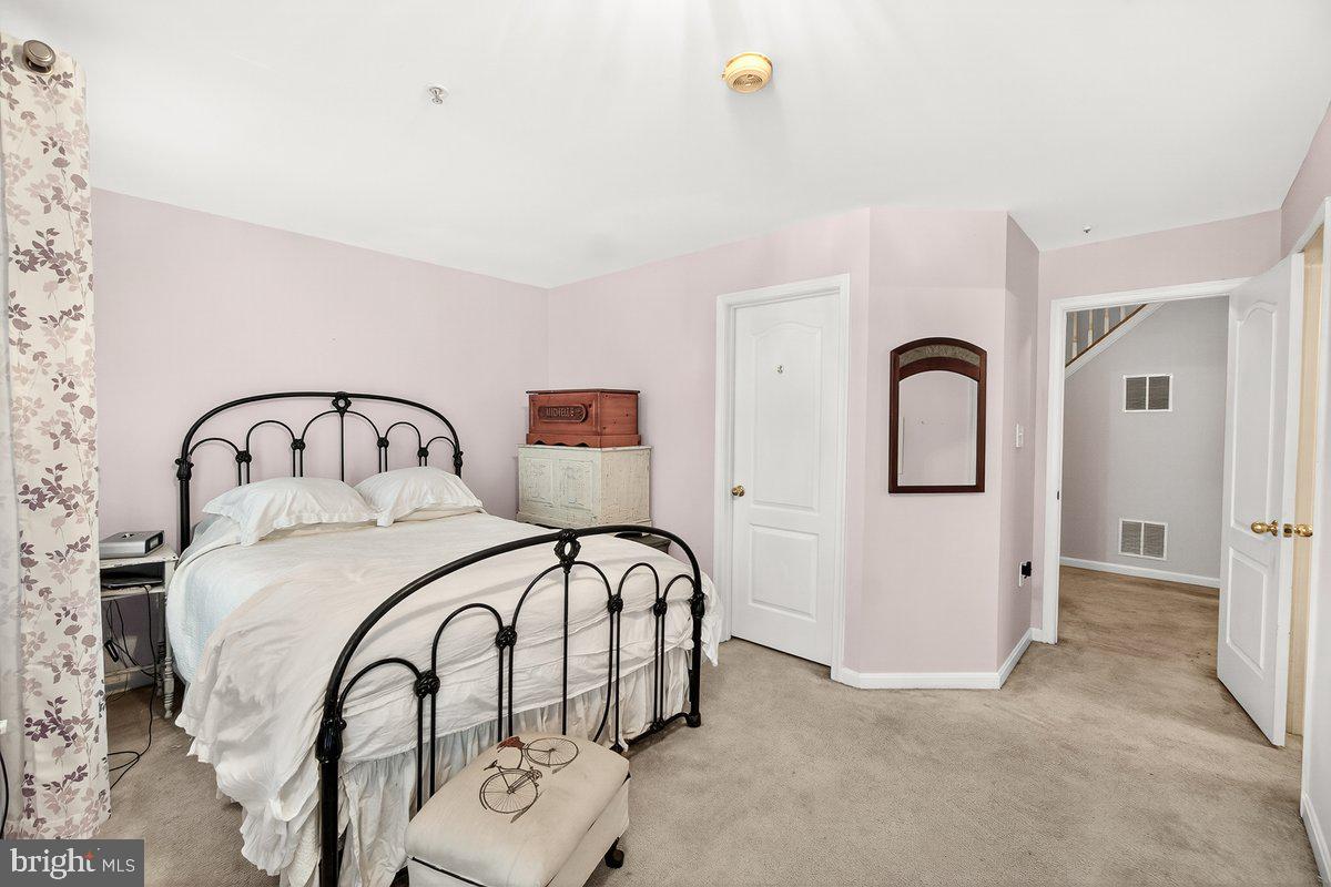 2663 South Everly Drive, Unit 75 Frederick, MD 21701 - Photo 22 of 39 a bedroom with a bed and a sink