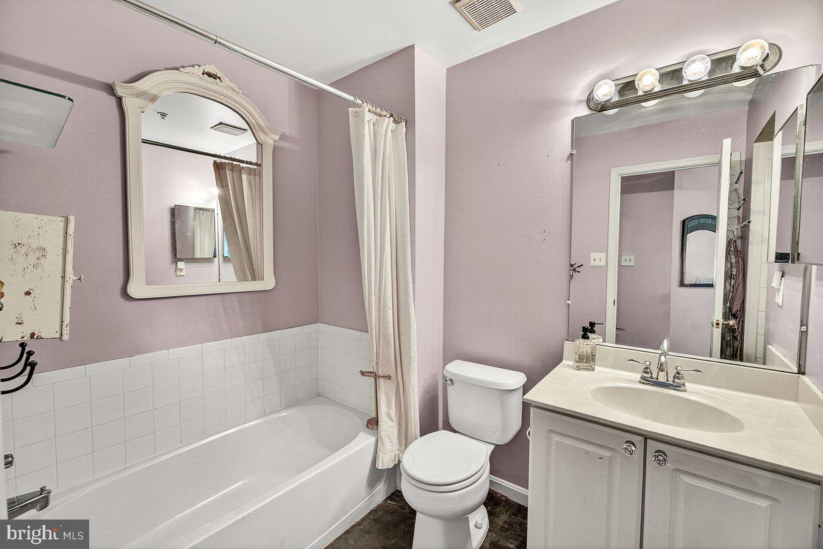 2663 South Everly Drive, Unit 75 Frederick, MD 21701 - Photo 23 of 39 a bathroom with a toilet sink and mirror