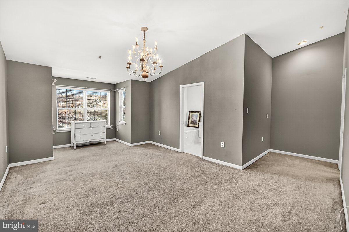 2663 South Everly Drive, Unit 75 Frederick, MD 21701 - Photo 25 of 39 a view of an empty room with a window
