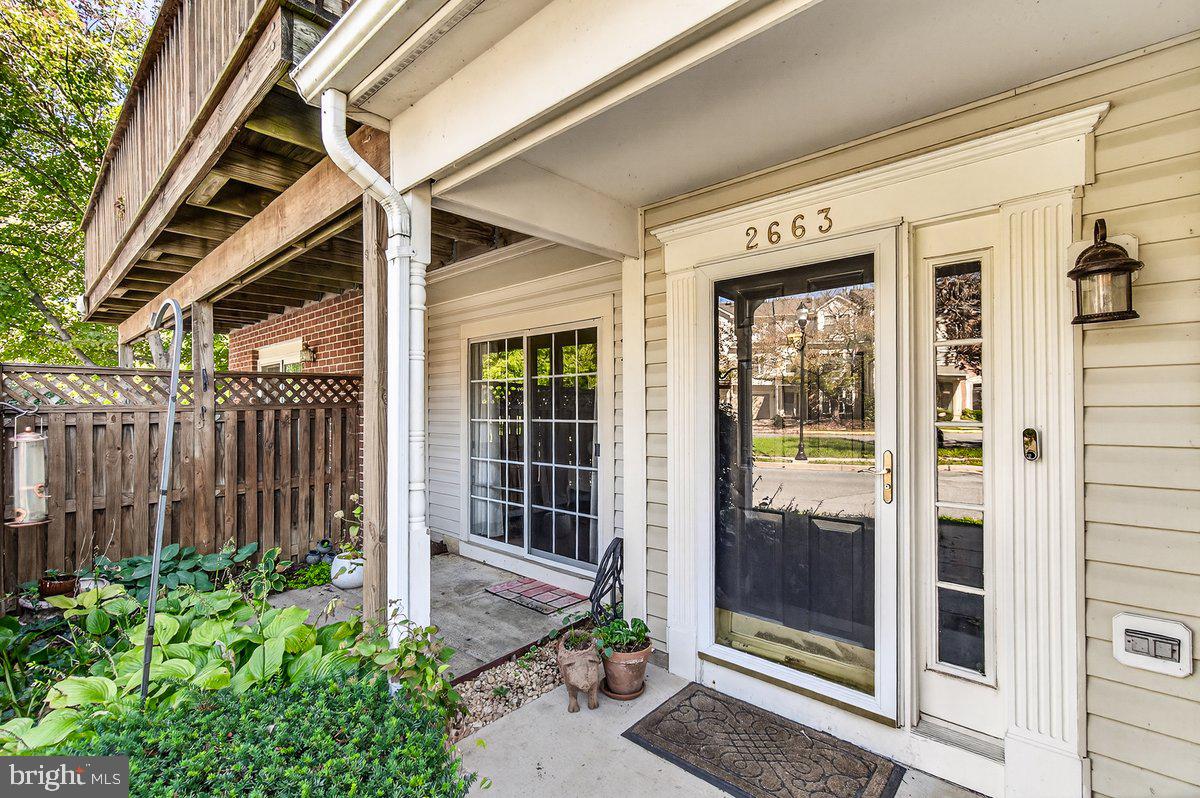 2663 South Everly Drive, Unit 75 Frederick, MD 21701 - Photo 3 of 39 a front view of a house with a glass door and glass door