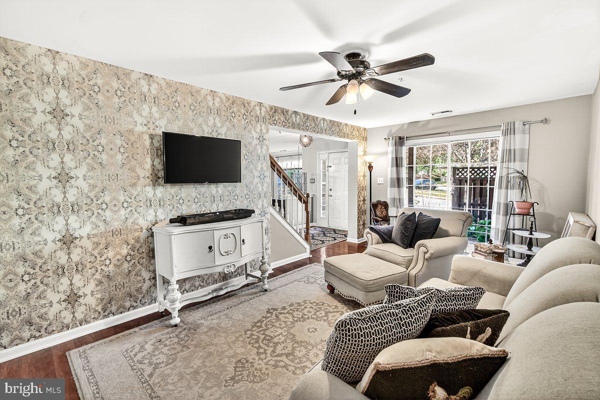 2663 South Everly Drive, Unit 75 Frederick, MD 21701 - Photo 8 of 39 a living room with furniture a ceiling fan and a flat screen tv