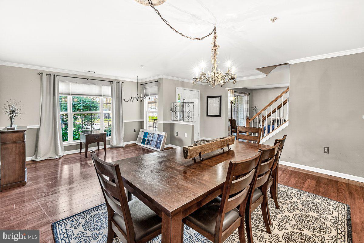 2663 South Everly Drive, Unit 75 Frederick, MD 21701 - Photo 10 of 39 a view of a dining room with furniture window and wooden floor