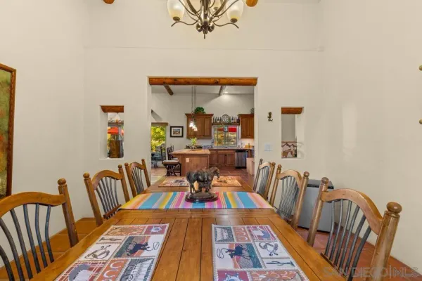a bedroom with a bed a window and glass door