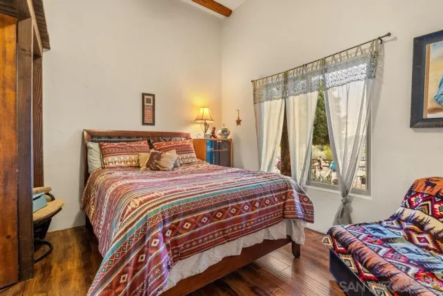 a bedroom with a bed and a couch