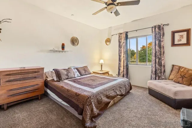 a view of sitting area with furniture and a lake view