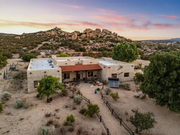 an aerial view of a house with a garden