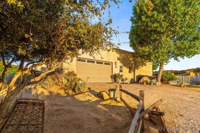 an aerial view of residential houses with city view
