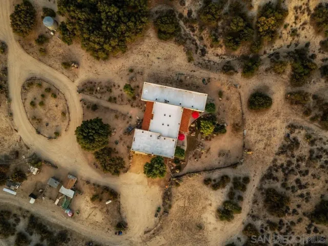 a front view of a building with parking