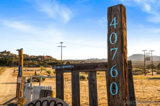 a kitchen with stainless steel appliances granite countertop a sink counter space cabinets and a large window