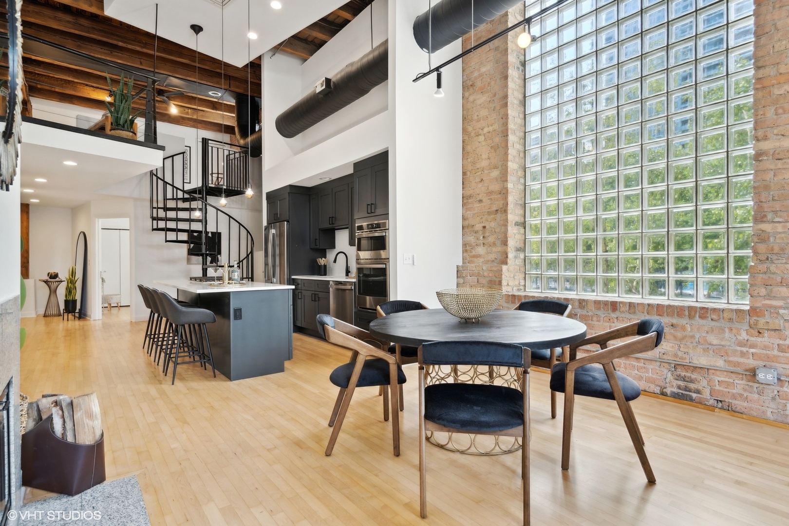 11 North Green Street, Unit 2D Chicago, IL 60607 - Photo 12 of 26 a view of a dining room with furniture and a large window