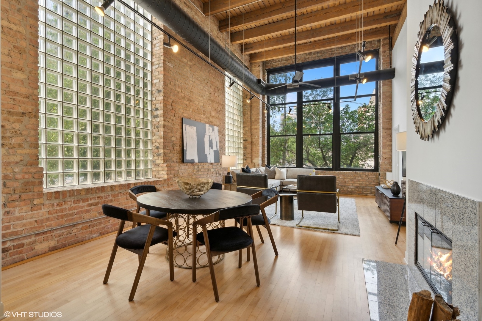 11 North Green Street, Unit 2D Chicago, IL 60607 - Photo 10 of 26 a view of a dining room with furniture a chandelier and wooden floor