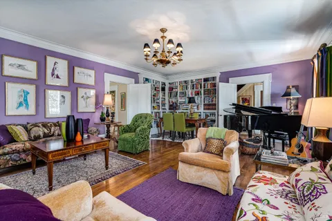 a view of an entryway with wooden floor and windows