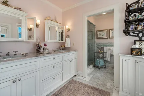 a living room with furniture a fireplace and a window