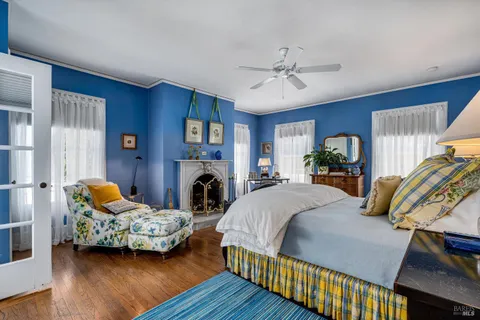 a spacious bathroom with a toilet sink and mirror