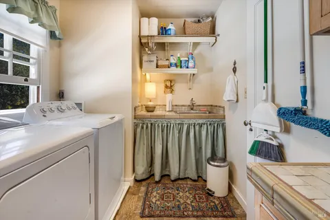 a view of a patio with table and chairs and potted plants