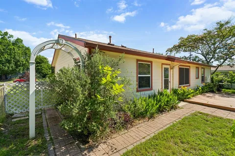 a front view of a house with garden