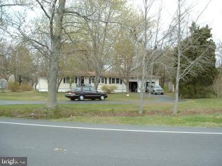 23680 Deal Island Road Chance, MD 21821 - Photo 3 of 5 a view of house with a yard
