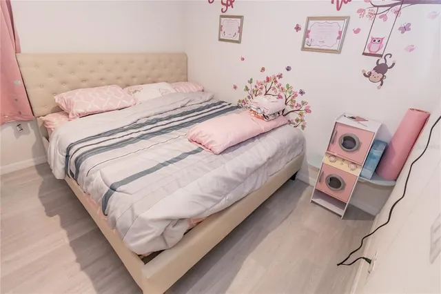 a bedroom with a bed and a couch