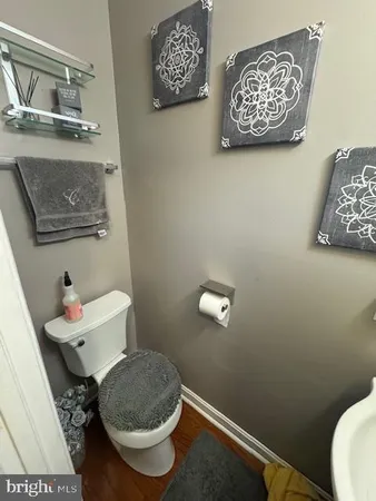 a bathroom with a toilet and a sink