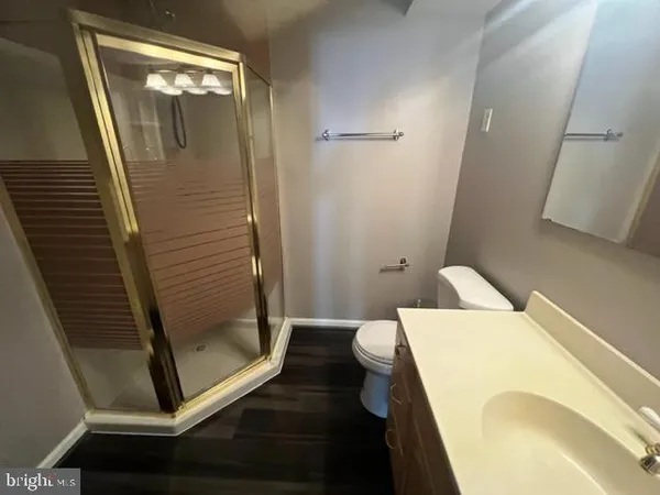 a backyard of a house with barbeque and wooden fence