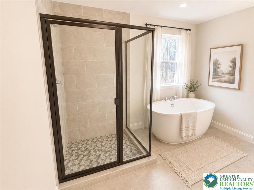 777 Adams Road Breinigsville, PA 18031 - Photo 11 of 24 a bathroom with a bathtub and shower