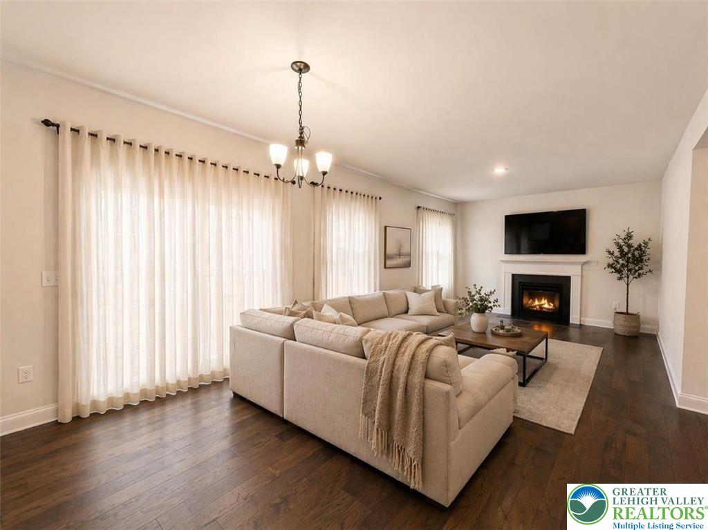 777 Adams Road Breinigsville, PA 18031 - Photo 6 of 24 a living room with furniture fireplace and flat screen tv