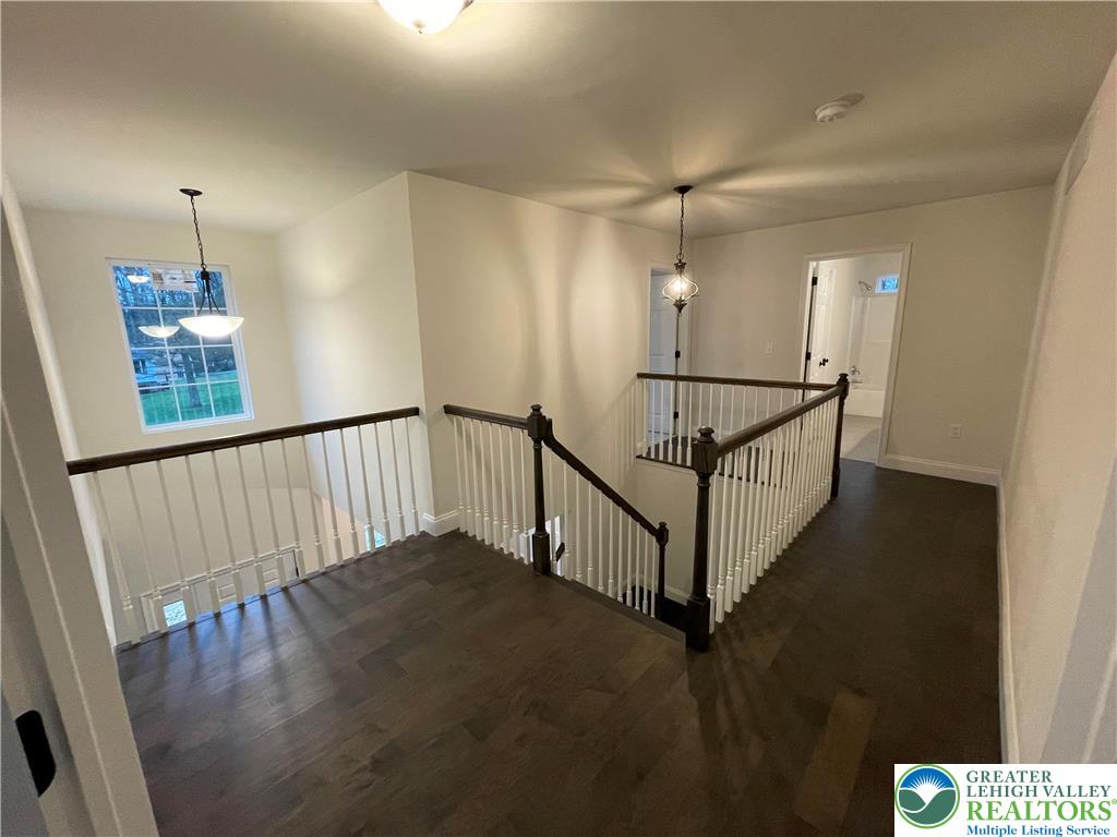 777 Adams Road Breinigsville, PA 18031 - Photo 9 of 24 a view of a hallway with wooden floor