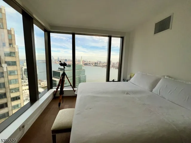 a kitchen with a sink and white cabinets