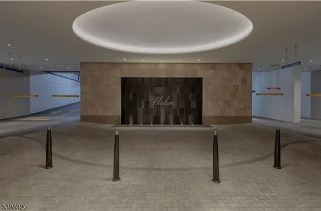 a view of building with cars parked