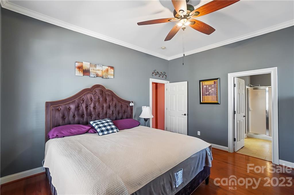 2557 Lower Assembly Drive Fort Mill, SC 29708 - Photo 19 of 32 a bedroom with a bed and a chandelier