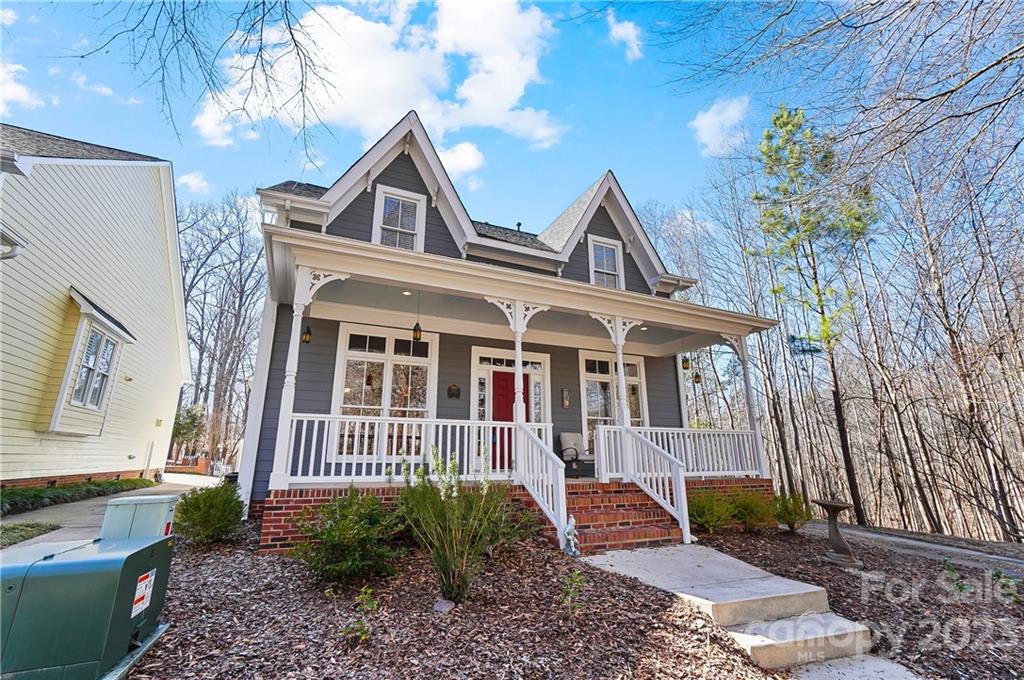 2557 Lower Assembly Drive Fort Mill, SC 29708 - Photo 2 of 32 a front view of a house with garden