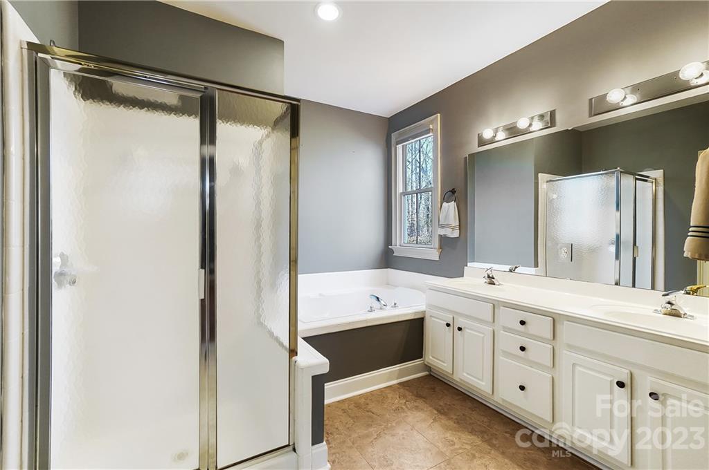 2557 Lower Assembly Drive Fort Mill, SC 29708 - Photo 21 of 32 a bathroom with a double vanity sink mirror double and shower