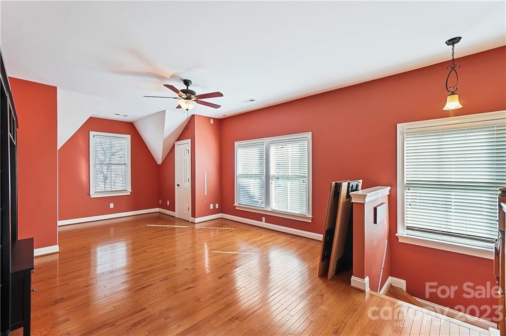 2557 Lower Assembly Drive Fort Mill, SC 29708 - Photo 22 of 32 a view of an empty room with window and wooden floor