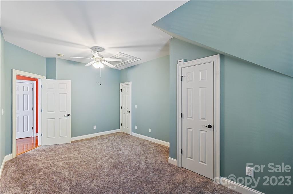 2557 Lower Assembly Drive Fort Mill, SC 29708 - Photo 25 of 32 a view of a livingroom with a chandelier fan