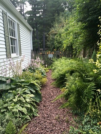 6 Colonial Road Wilbraham, MA 01095 - Photo 13 of 17 a backyard of a house with lots of green space