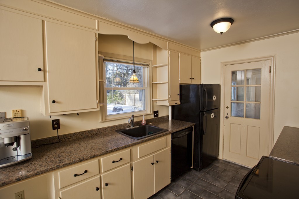 6 Colonial Road Wilbraham, MA 01095 - Photo 4 of 17 a kitchen with a refrigerator and a sink