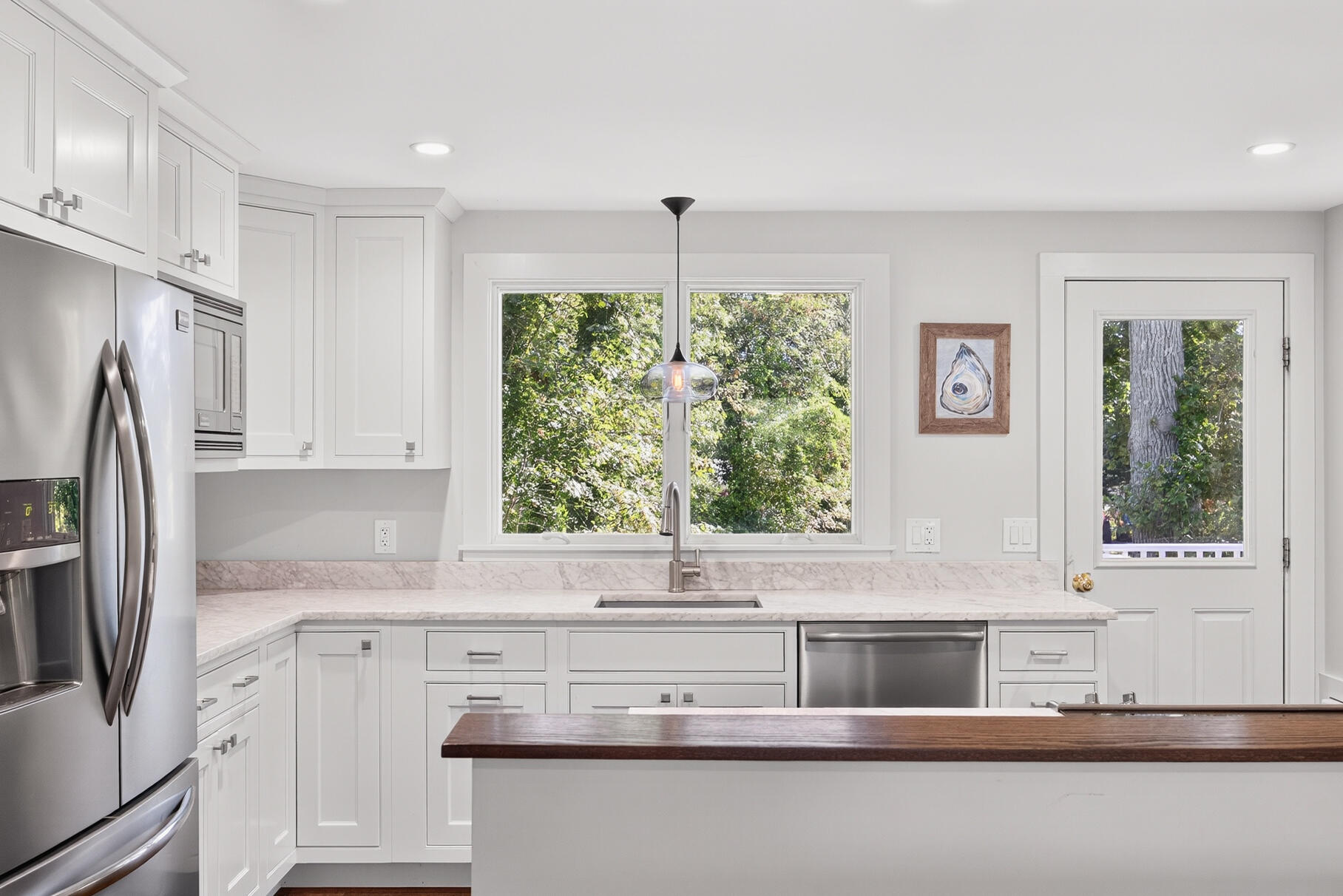 95 South Orleans Road Orleans, MA 02653 - Photo 11 of 38 a kitchen with a refrigerator and a sink