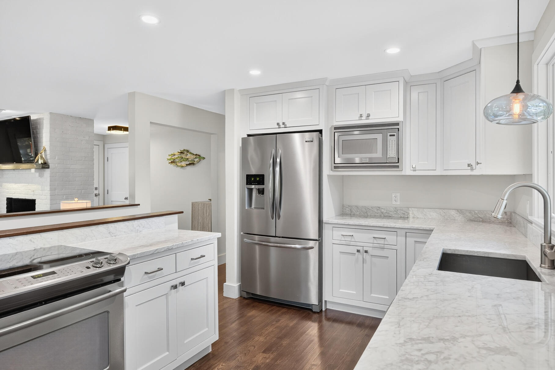 95 South Orleans Road Orleans, MA 02653 - Photo 12 of 38 a kitchen with cabinets stainless steel appliances and wooden floor