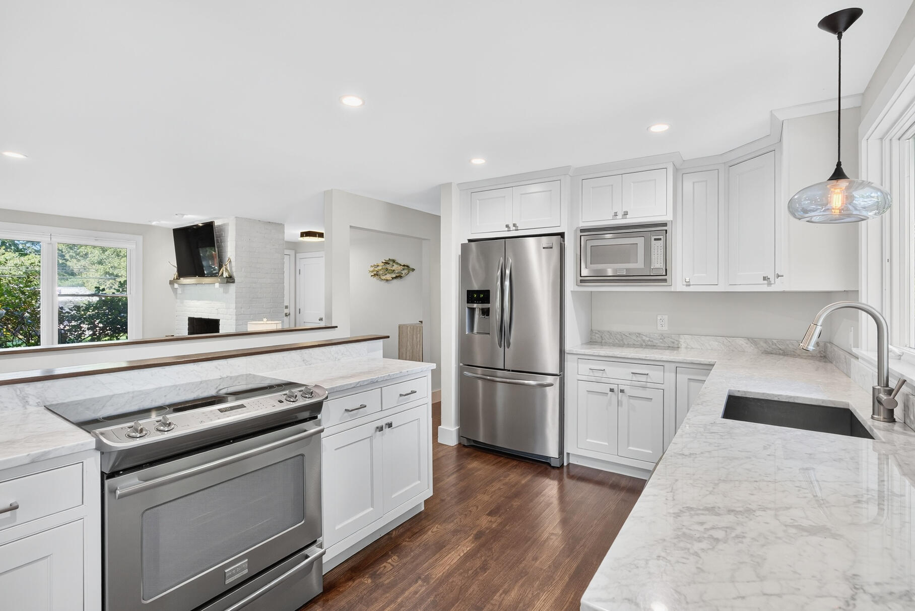 95 South Orleans Road Orleans, MA 02653 - Photo 13 of 38 a kitchen with stainless steel appliances a stove a sink and a refrigerator