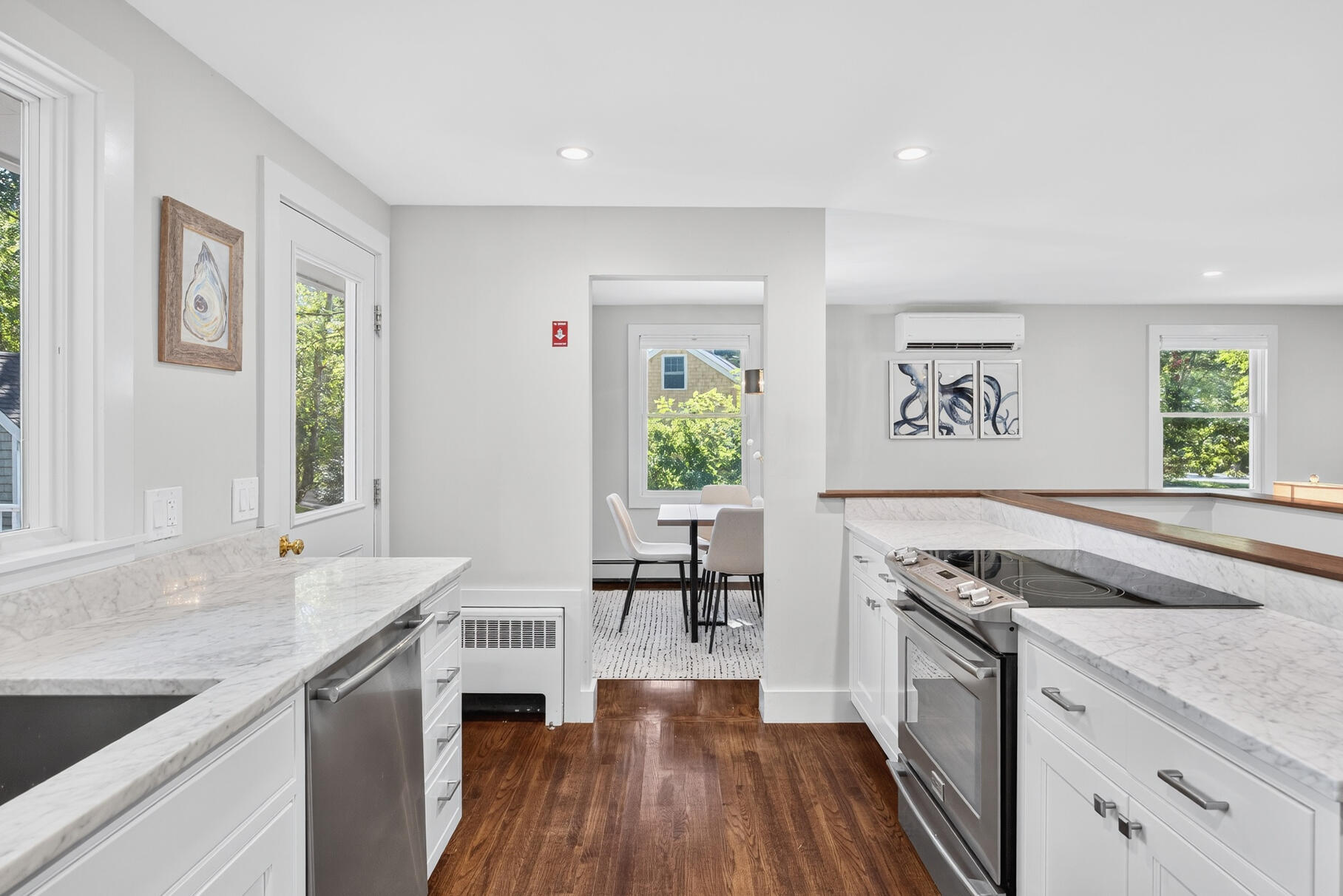 95 South Orleans Road Orleans, MA 02653 - Photo 15 of 38 a kitchen with granite countertop a sink cabinets wooden floor and stainless steel appliances
