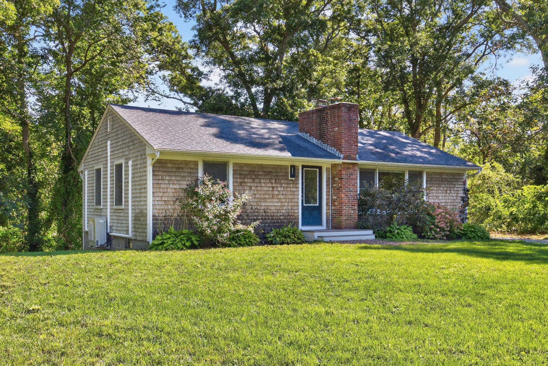 95 South Orleans Road Orleans, MA 02653 - Photo 32 of 38 a front view of a house with a yard and garage