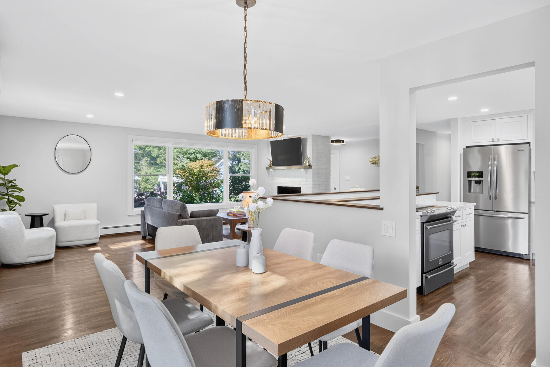 95 South Orleans Road Orleans, MA 02653 - Photo 5 of 38 a view of a dining room and livingroom with furniture wooden floor a chandelier