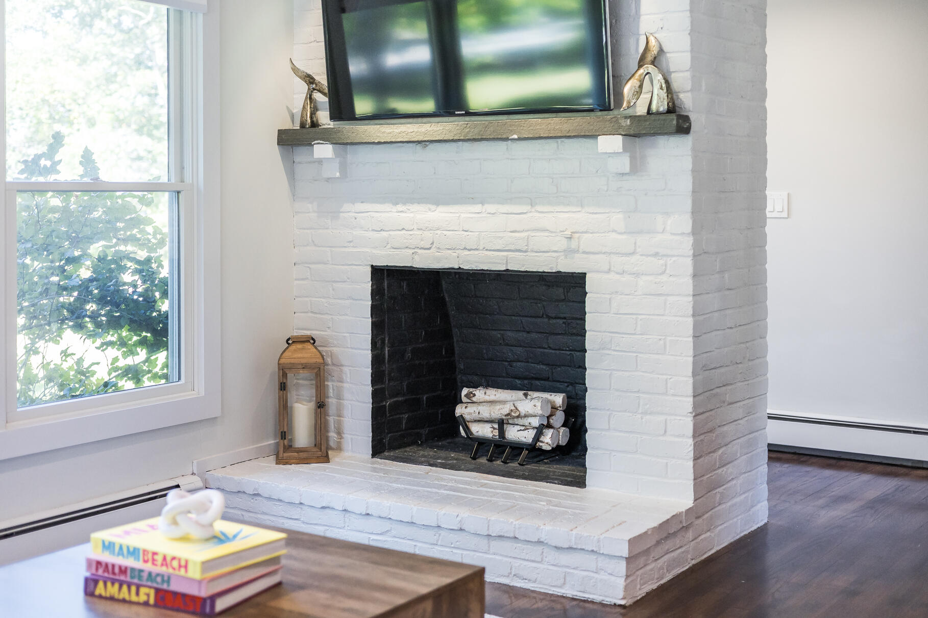 95 South Orleans Road Orleans, MA 02653 - Photo 8 of 38 a living room with furniture and a fireplace