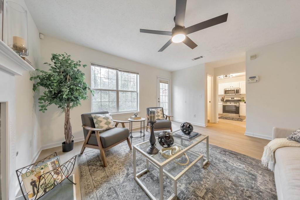 334 Fallview Drive McDonough, GA 30253 - Photo 16 of 34 a living room with furniture and a potted plant