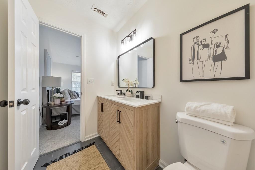 334 Fallview Drive McDonough, GA 30253 - Photo 21 of 34 a bathroom with a sink mirror and toilet